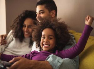 Family-Playing-and-Smiling